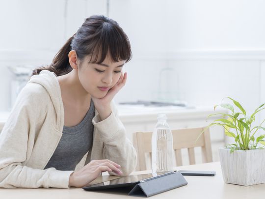 Woman downloading software on iPad