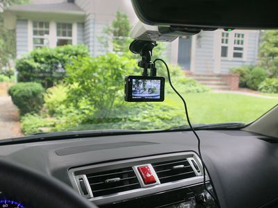 Dash cam in vehicle in front of home