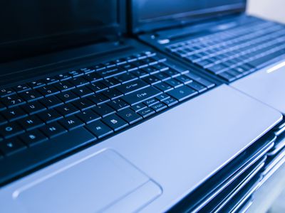 Refurbished laptops stacks and ready for sale.