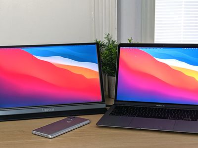 A dual monitor setup with a MacBook Air