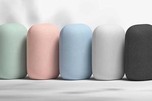 An assortment of Google Nest Audio speakers in various colors.