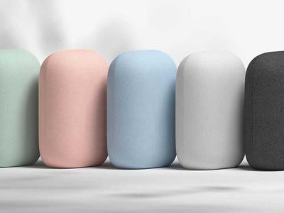 An assortment of Google Nest Audio speakers in various colors.