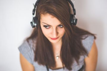 Person wearing headphones.