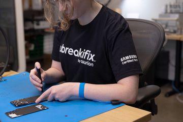 A uBreakiFix employee working on a Galaxy device.