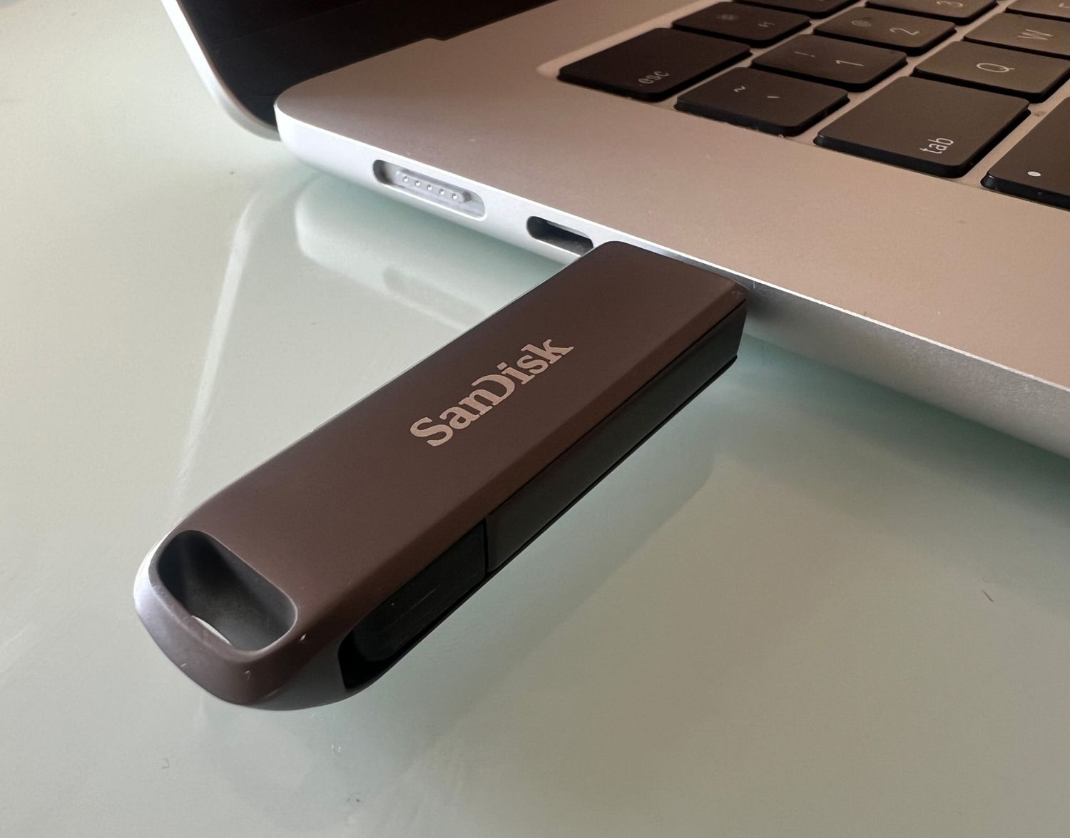 A USB Type-C flash drive plugged into a laptop