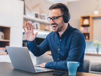 Man using a web conferencing service on a laptop