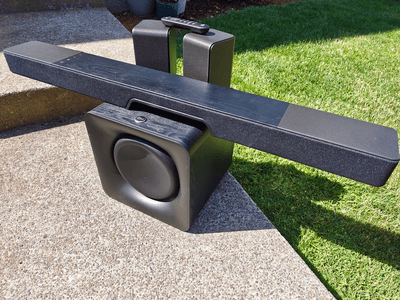 Klipsch Flexus 200 soundbar, woofer, satellite speakers, and remote