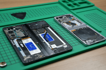 Open Samsung Galaxy Z Fold and Z Flip phones on a repair surface.